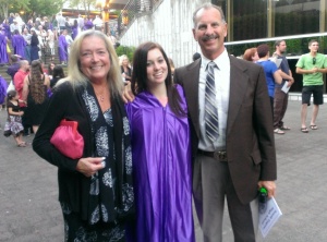 Happy grad with my mom and step dad!